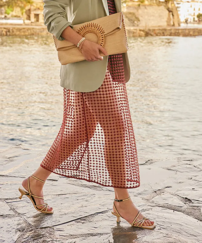 LILAH CLUTCH NATURAL EMBOSSED FAUX LEATHER sold by Dolce Vita