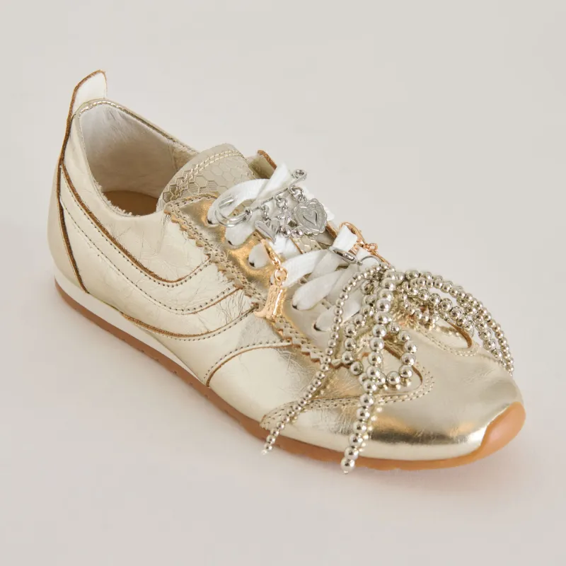 DELANY SNEAKERS LIGHT GOLD + PIN CHARM BUNDLE sold by Dolce Vita