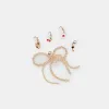 NOTICE SNEAKERS SESAME MESH + GOLD CHARM BUNDLE sold by Dolce Vita