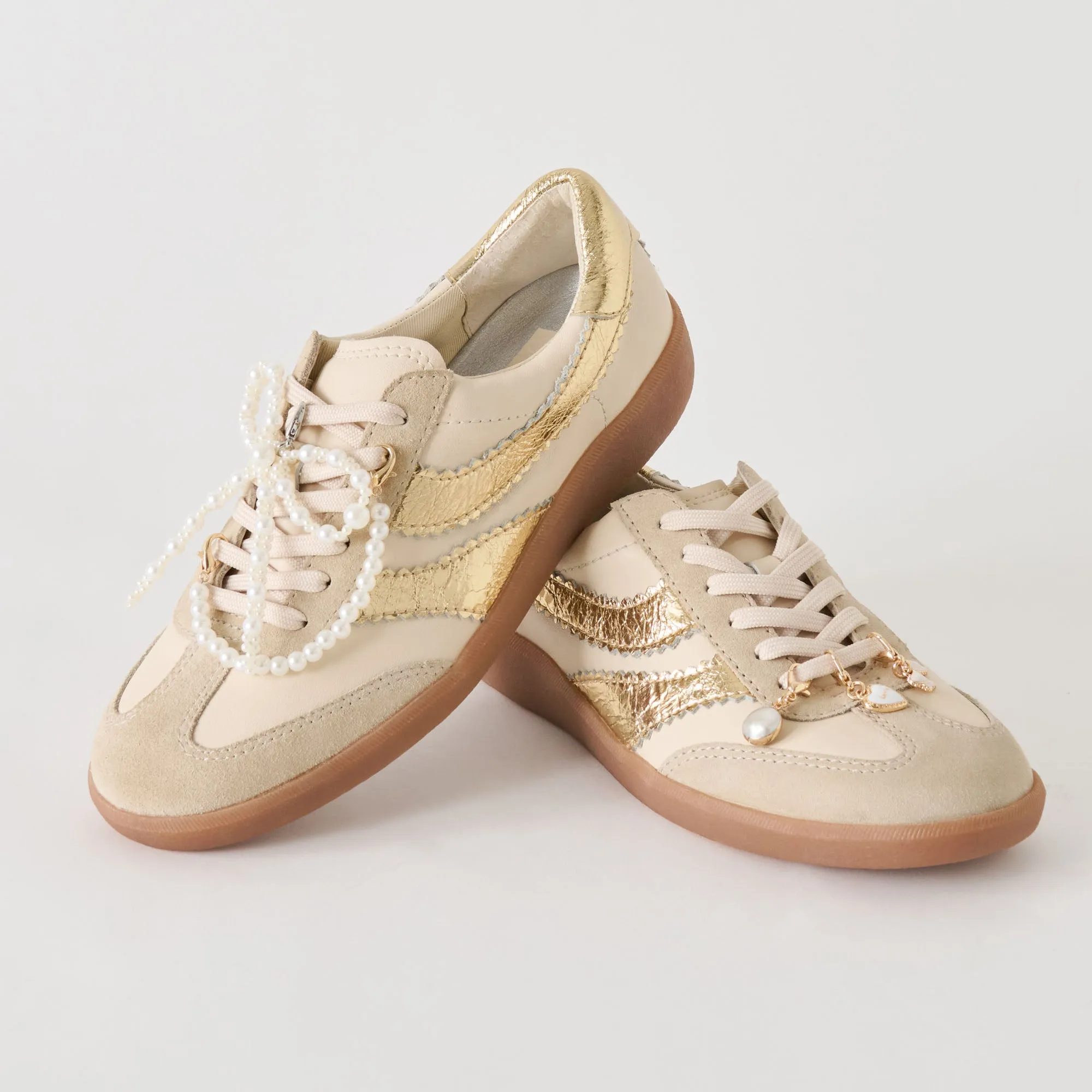 MERIT SNEAKERS WHITE GOLD LEATHER + PEARL CHARM BUNDLE sold by Dolce Vita