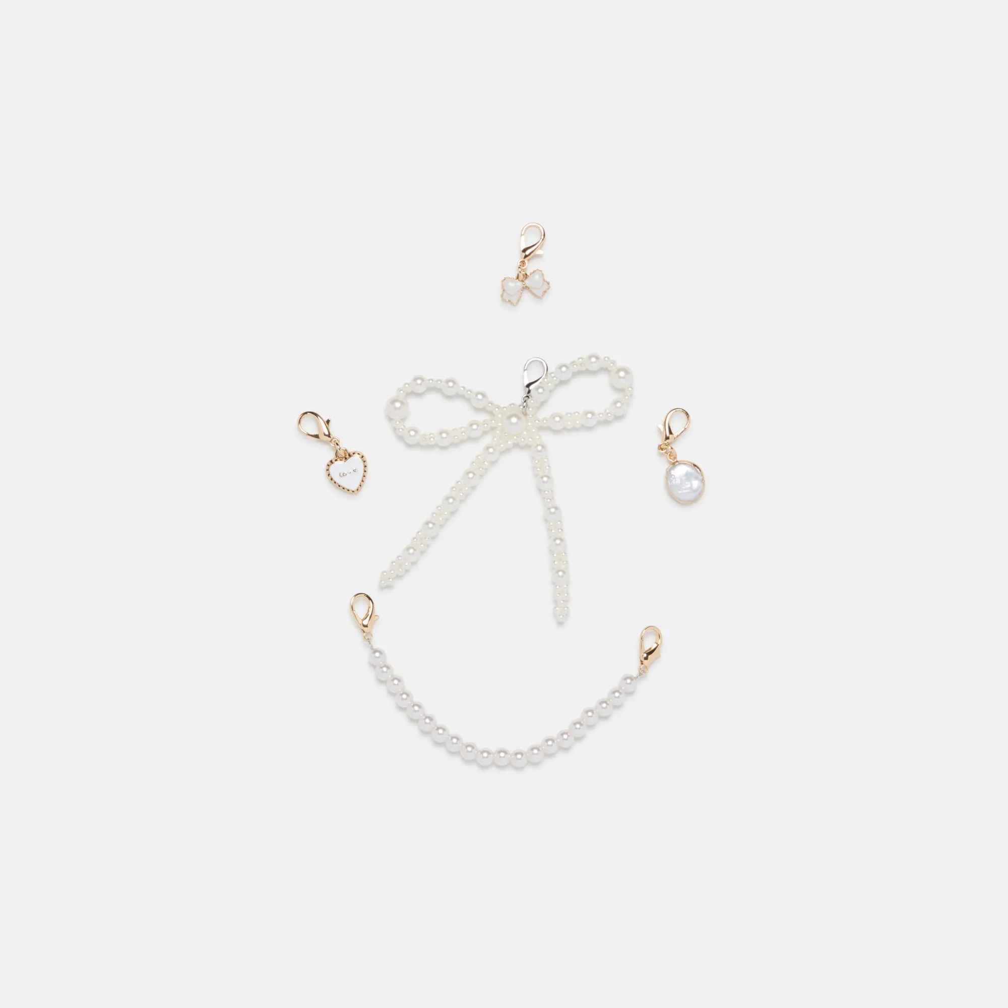 MERIT SNEAKERS WHITE GOLD LEATHER + PEARL CHARM BUNDLE sold by Dolce Vita product image thumbnail 4