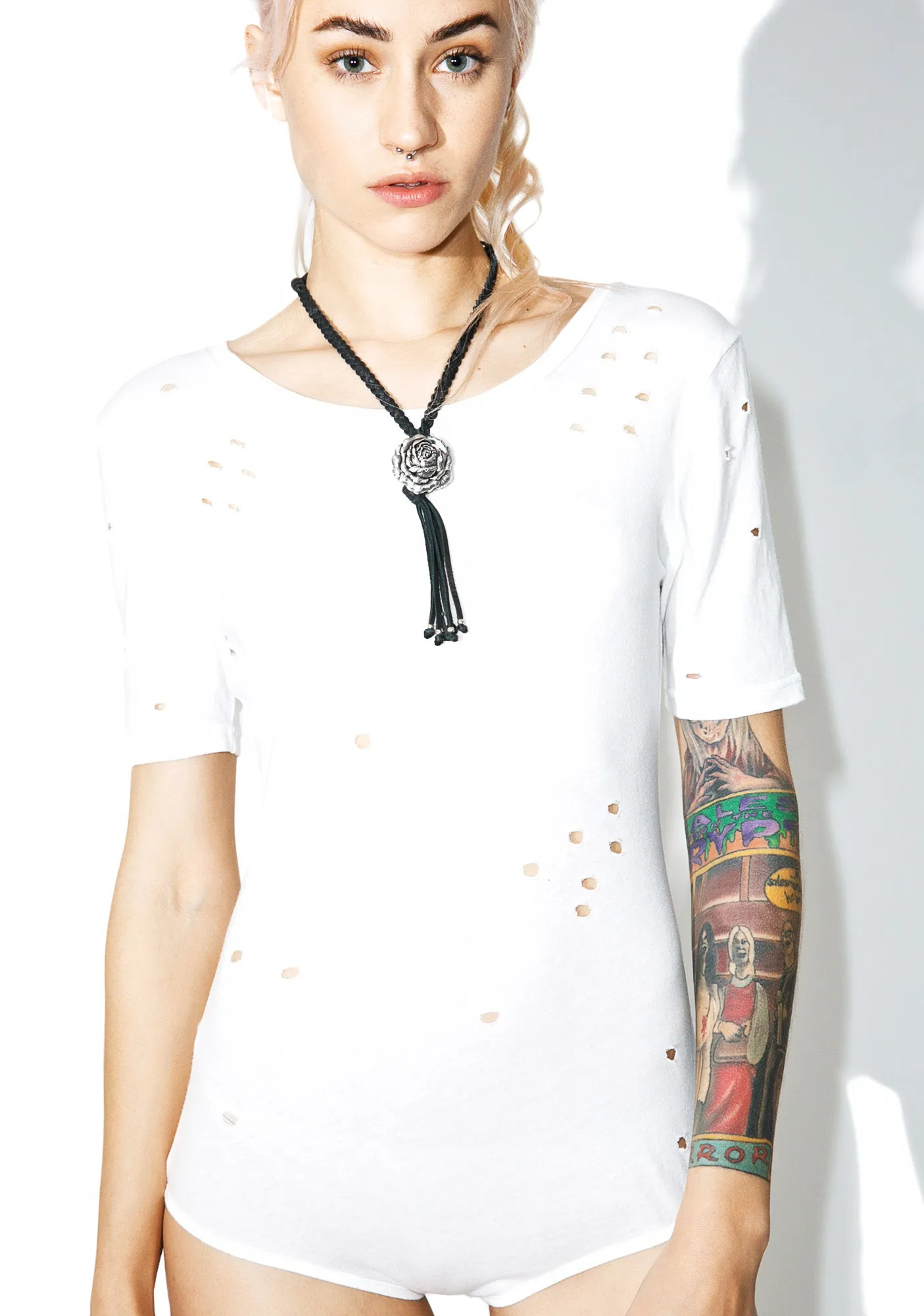 Play It Cool Distressed Bodysuit sold by Dolls Kill