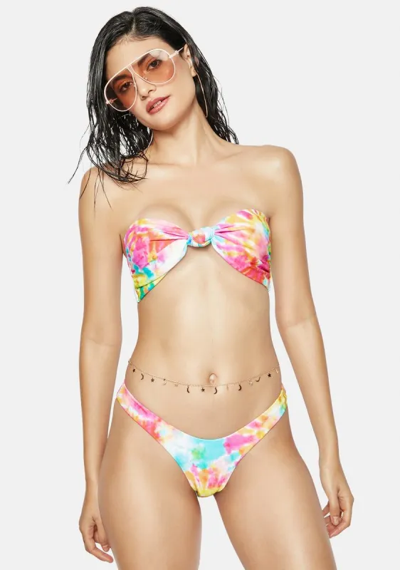 The Pink Tie Dye Knot Bandeau Bikini Top sold by Dolls Kill