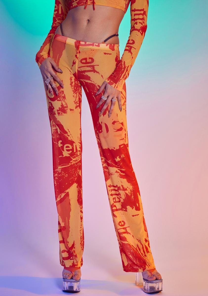 Orange Tonal Ripped Magazine Print Mesh Trousers sold by Dolls Kill