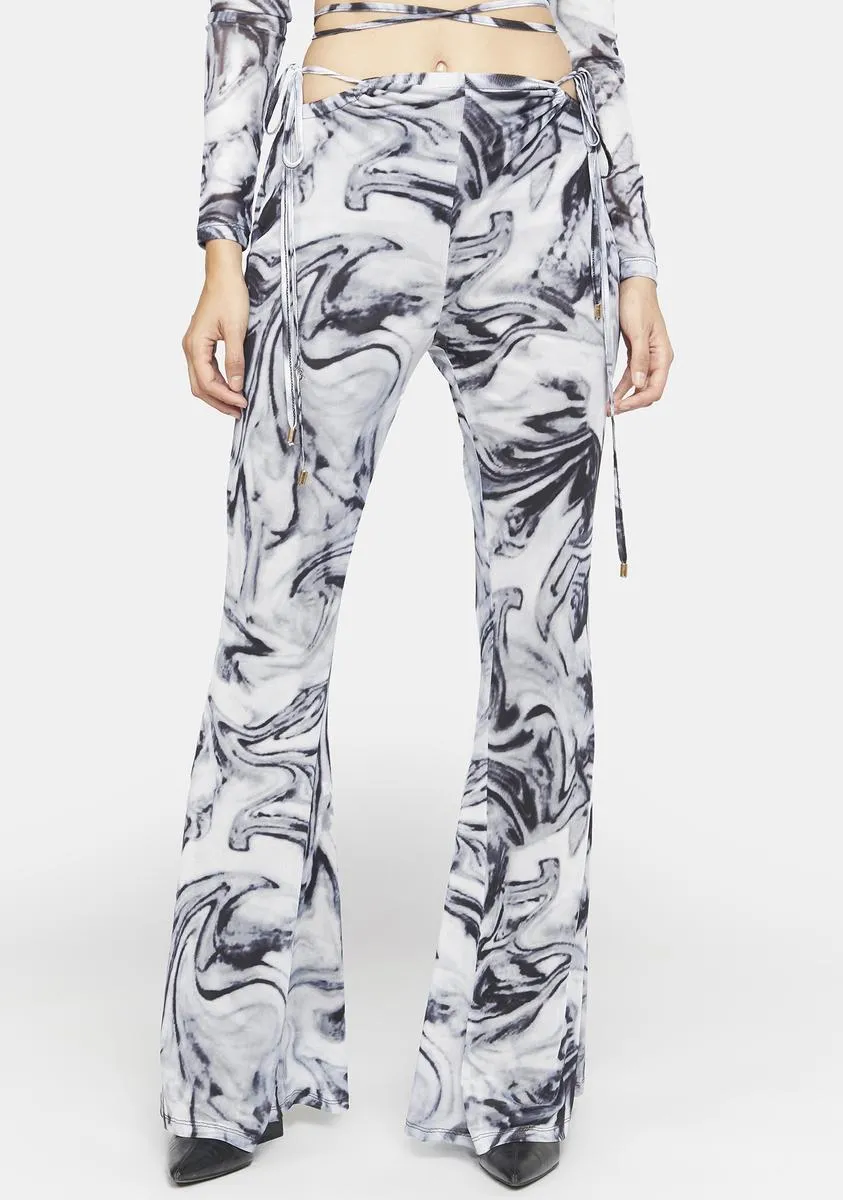 Mesh Swirl Print Cut Out Flare Trousers sold by Dolls Kill