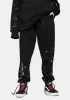 x Polaroid Spray Black Sweatpants sold by Dolls Kill