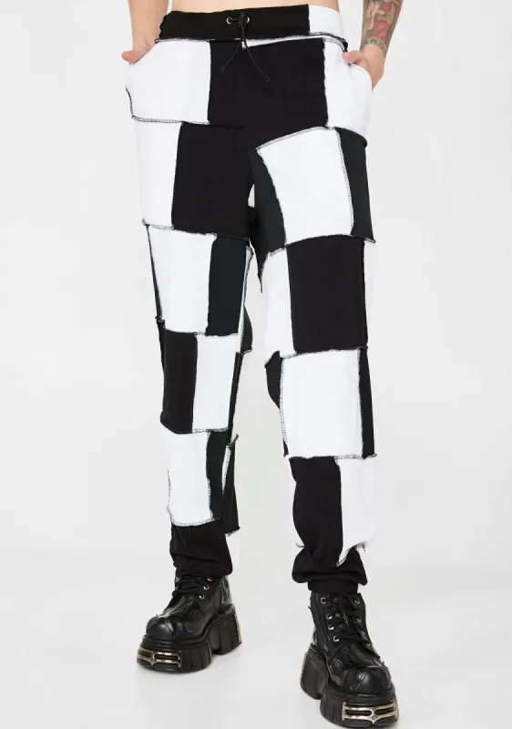Patchwork Checkerboard Joggers sold by Dolls Kill
