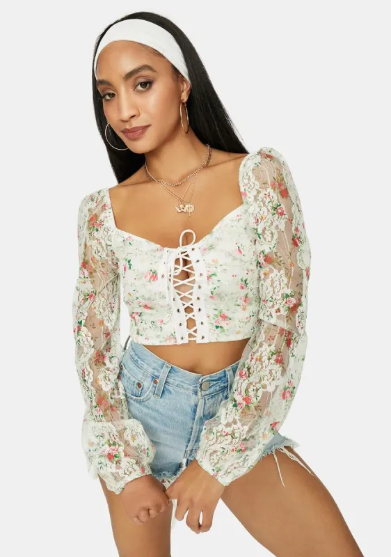A Girls World Sheer Floral Lace Crop Top sold by Dolls Kill