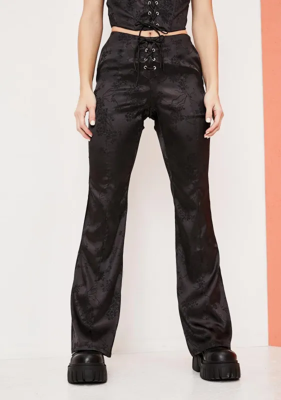 Slick Should Be Dancing Floral Satin Lace Up Pants sold by Dolls Kill