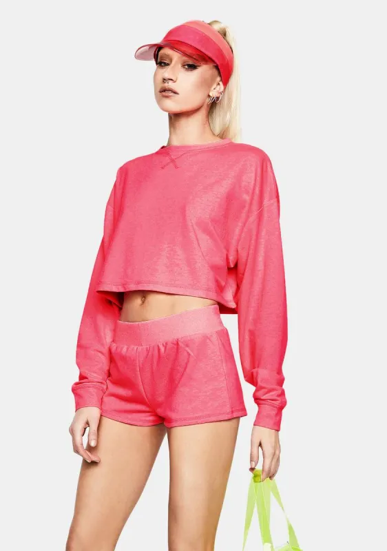 Fuchsia Feel The Rush Cropped Long Sleeve sold by Dolls Kill