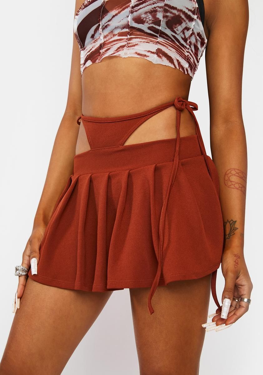 Cognac 90s Trick Pleated Mini Skirt sold by Dolls Kill