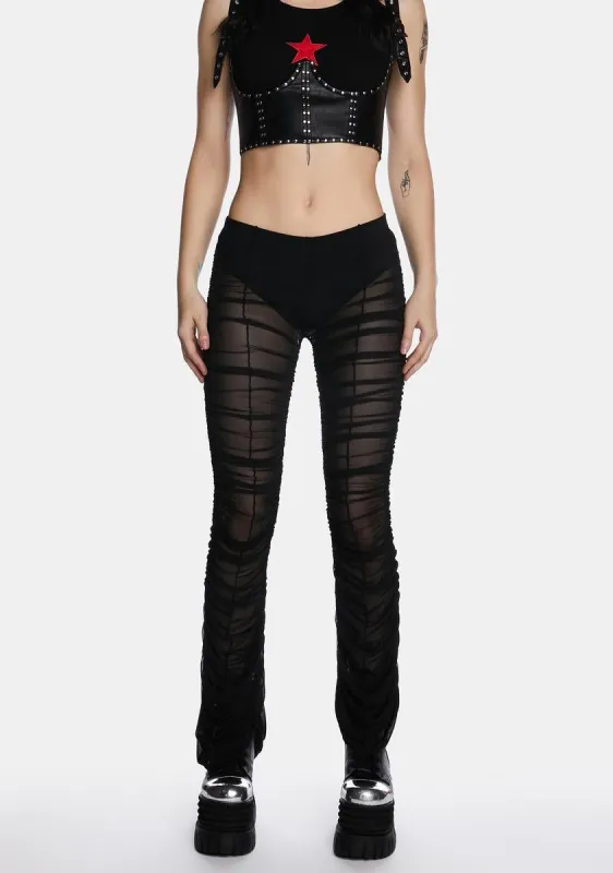 The Mosh Pit Mesh Flared Leggings sold by Dolls Kill
