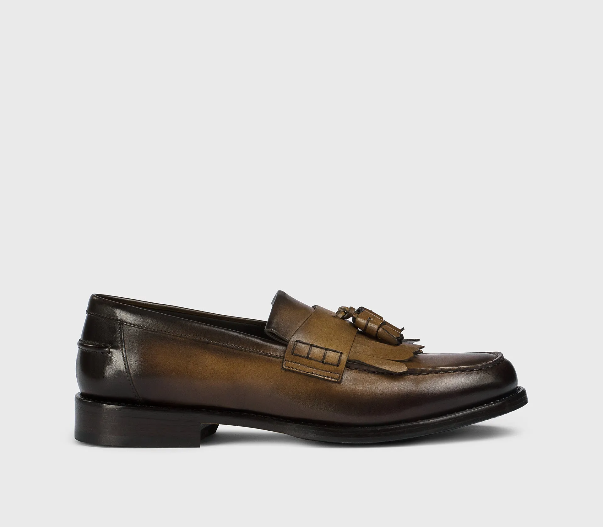 DU3498BRANUF159TM45 - Mocassino con nappine e frangia in pelle marrone "wood" sold by Doucal's