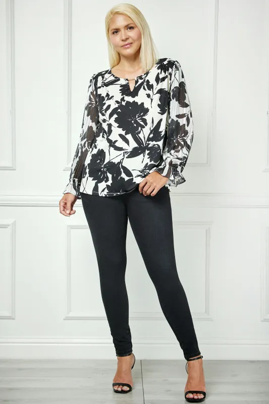 Long Ruffle Sleeve Cutout Trim Front Neck Mix Media Blouse - Plus sold by Dress Barn