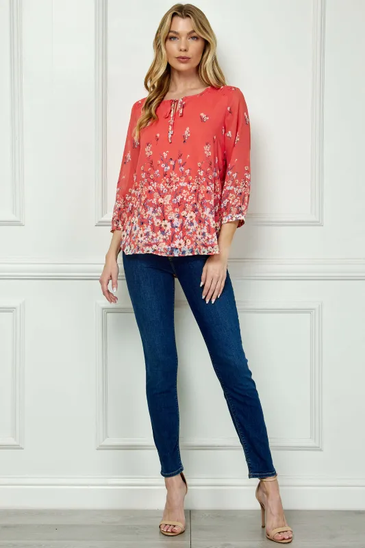 3/4 Button Cuff Sleeve Tie Neck Border Print Blouse in Coral sold by Dress Barn