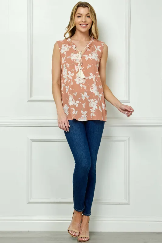 Sleeveless Ruffle Split Neck Tassel Blouse in Coral sold by Dress Barn