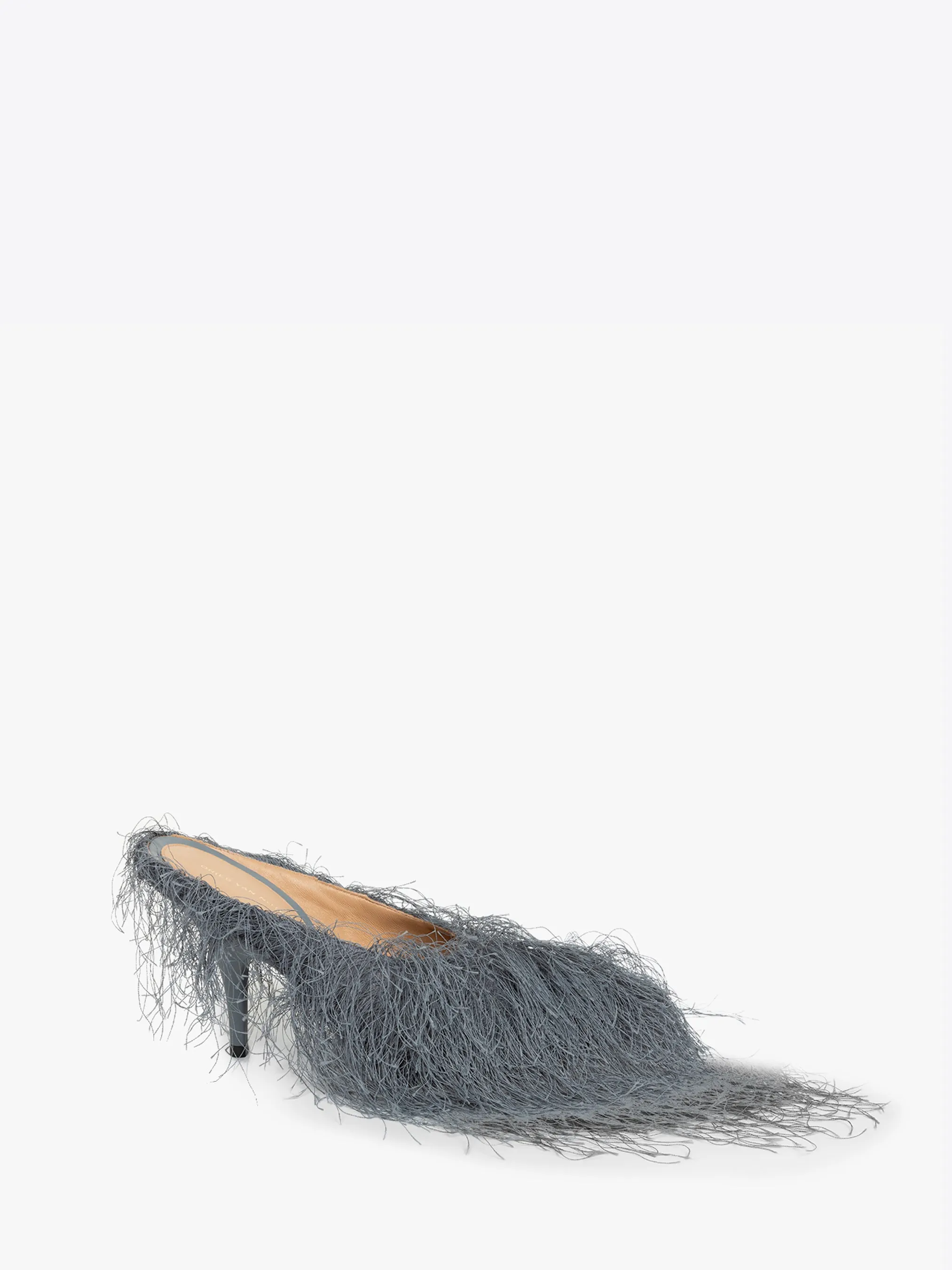 Heeled fringed mules sold by Dries Van Noten
