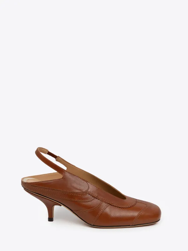 Leather slingback pumps sold by Dries Van Noten