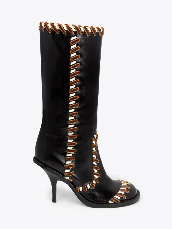 Round-toe leather boots sold by Dries Van Noten