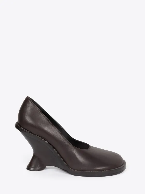 Leather wedge pumps sold by Dries Van Noten