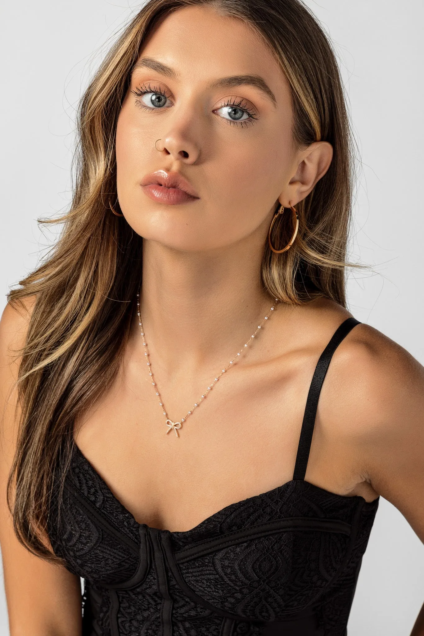 Gem Bow Necklace with Pearl Chain sold by Eclipse