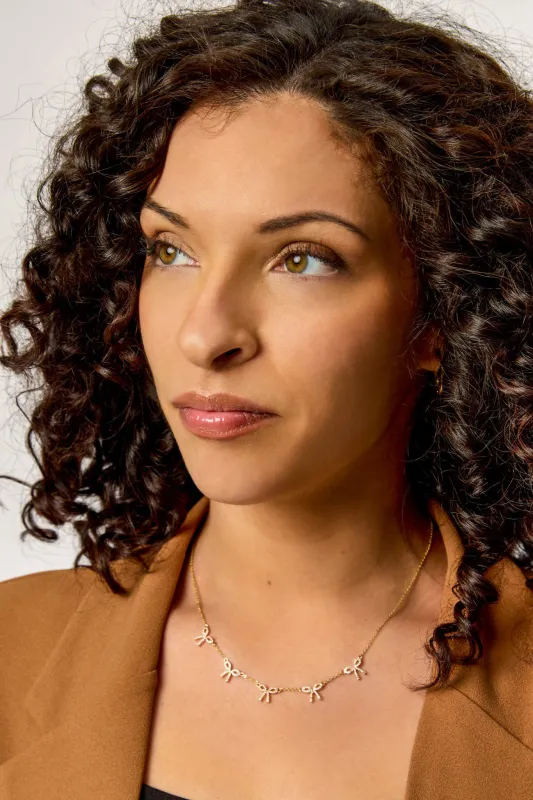 Mini-Rhinestone Bow Necklace sold by Eclipse