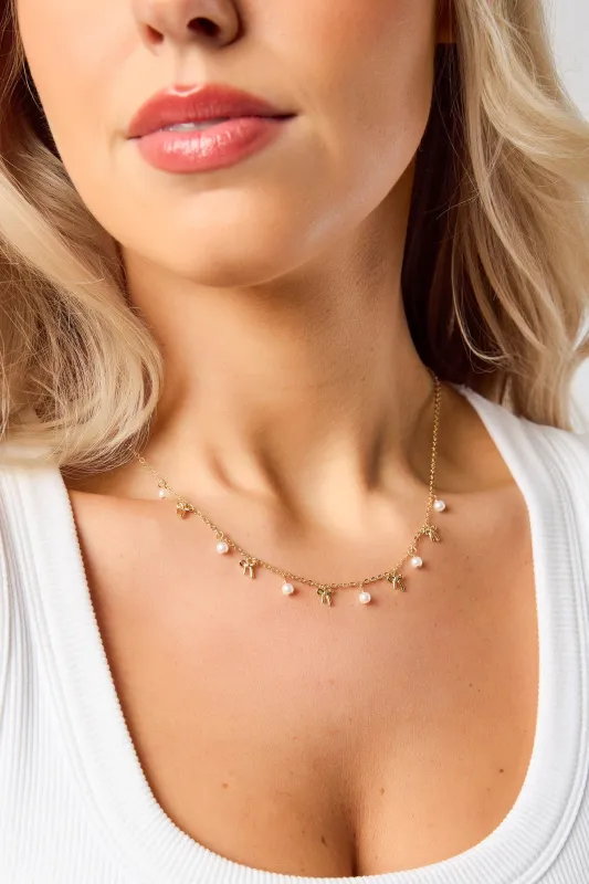Pearl & Bow Charm Delicate Necklace sold by Eclipse