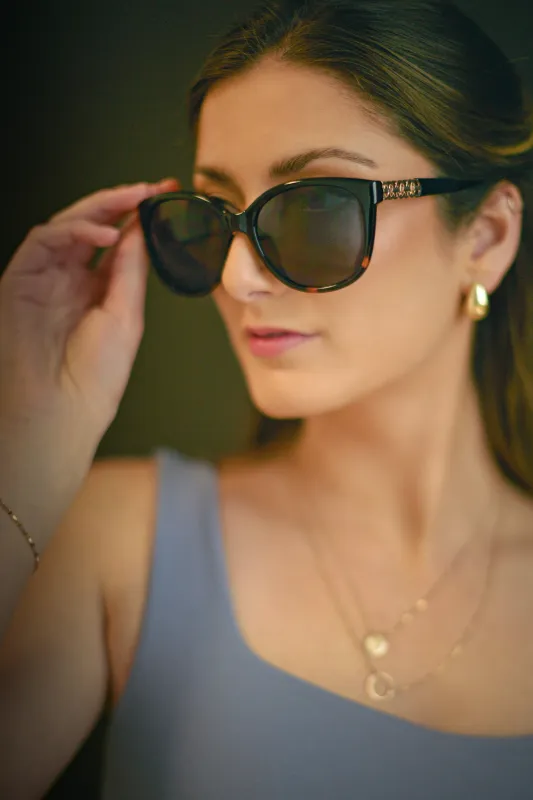 Black Tortoise Sunglasses with Interlocking Trim sold by Eclipse