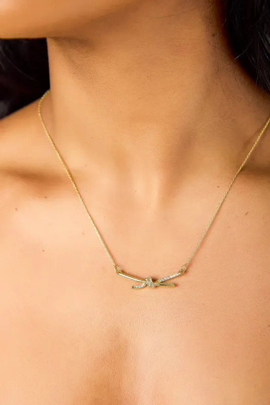 Rhinestone Knot Charm Necklace sold by Eclipse