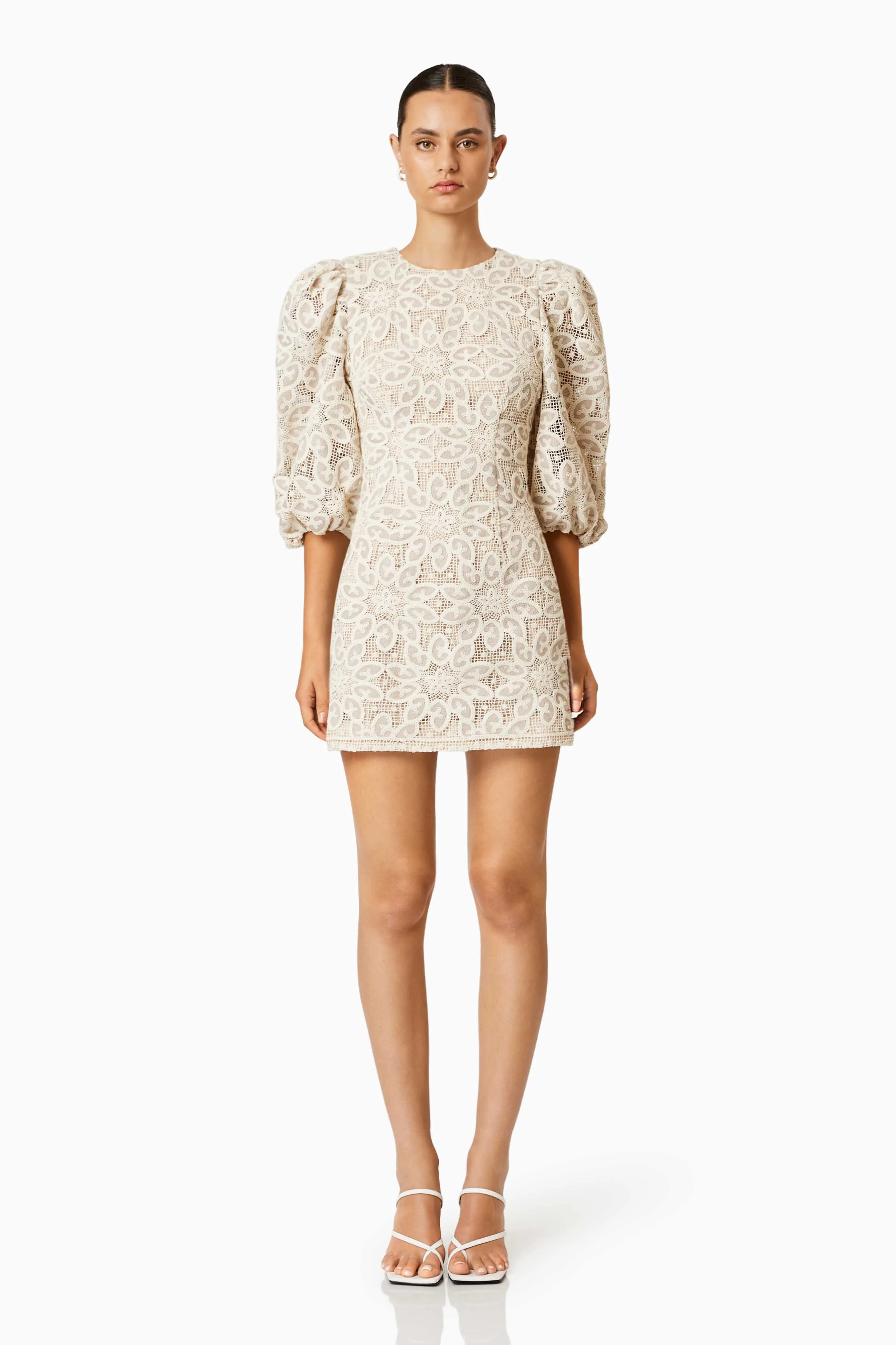 Cliffside Mini Lace Dress In White sold by Elliatt