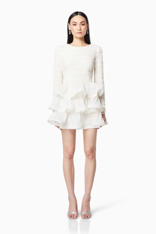 Sophisticate Ruffled Long Sleeved Mini Dress In White sold by Elliatt
