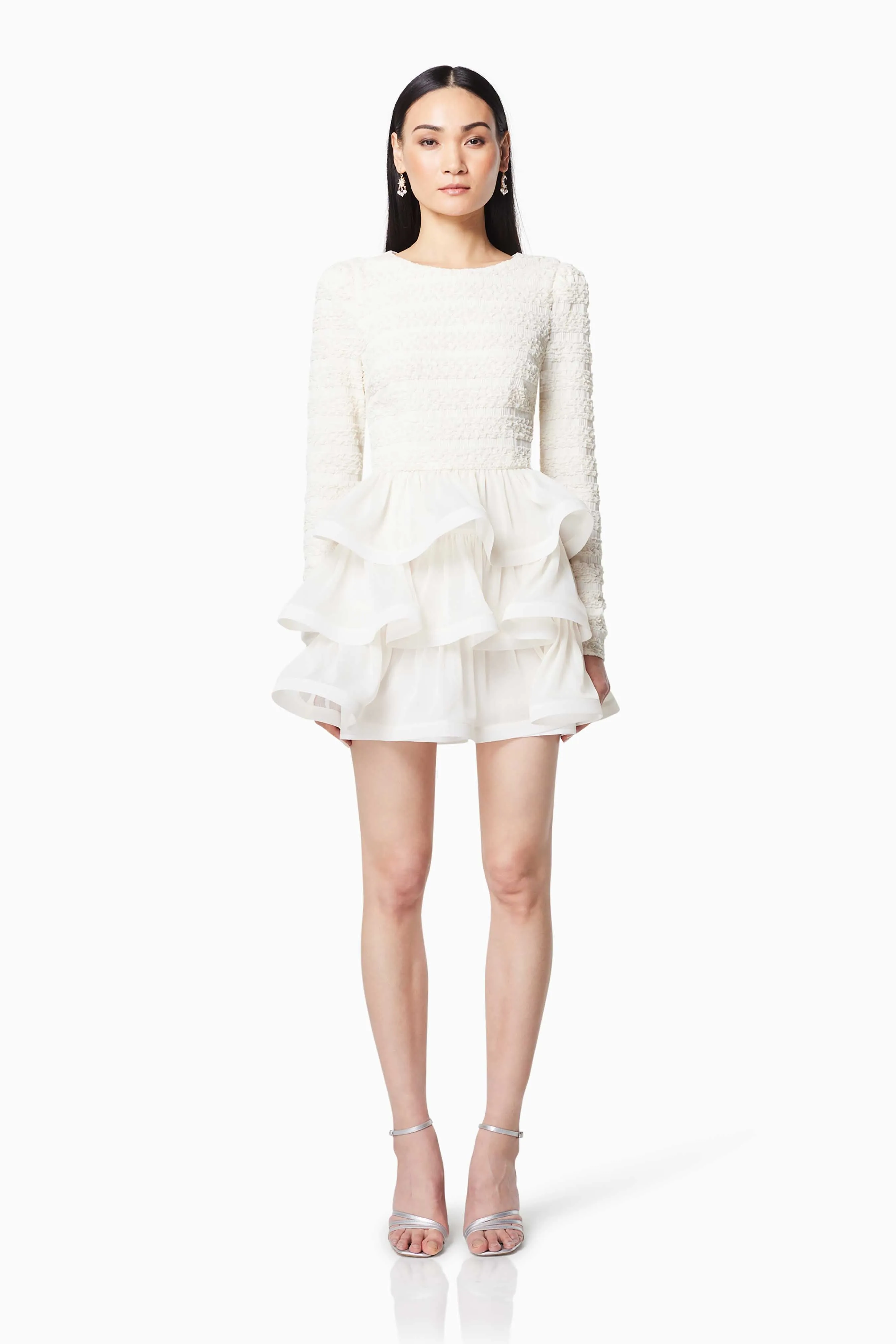 Sophisticate Ruffled Long Sleeved Mini Dress In White sold by Elliatt