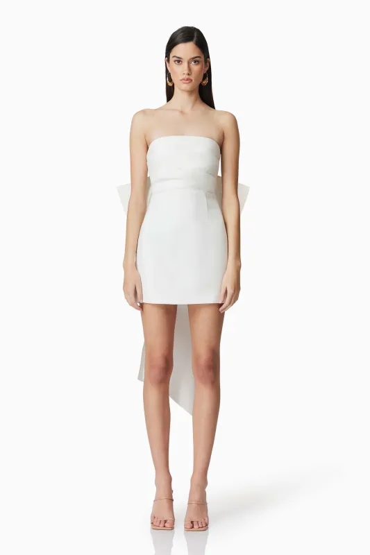 Celia Mini Bow Dress in White sold by Elliatt