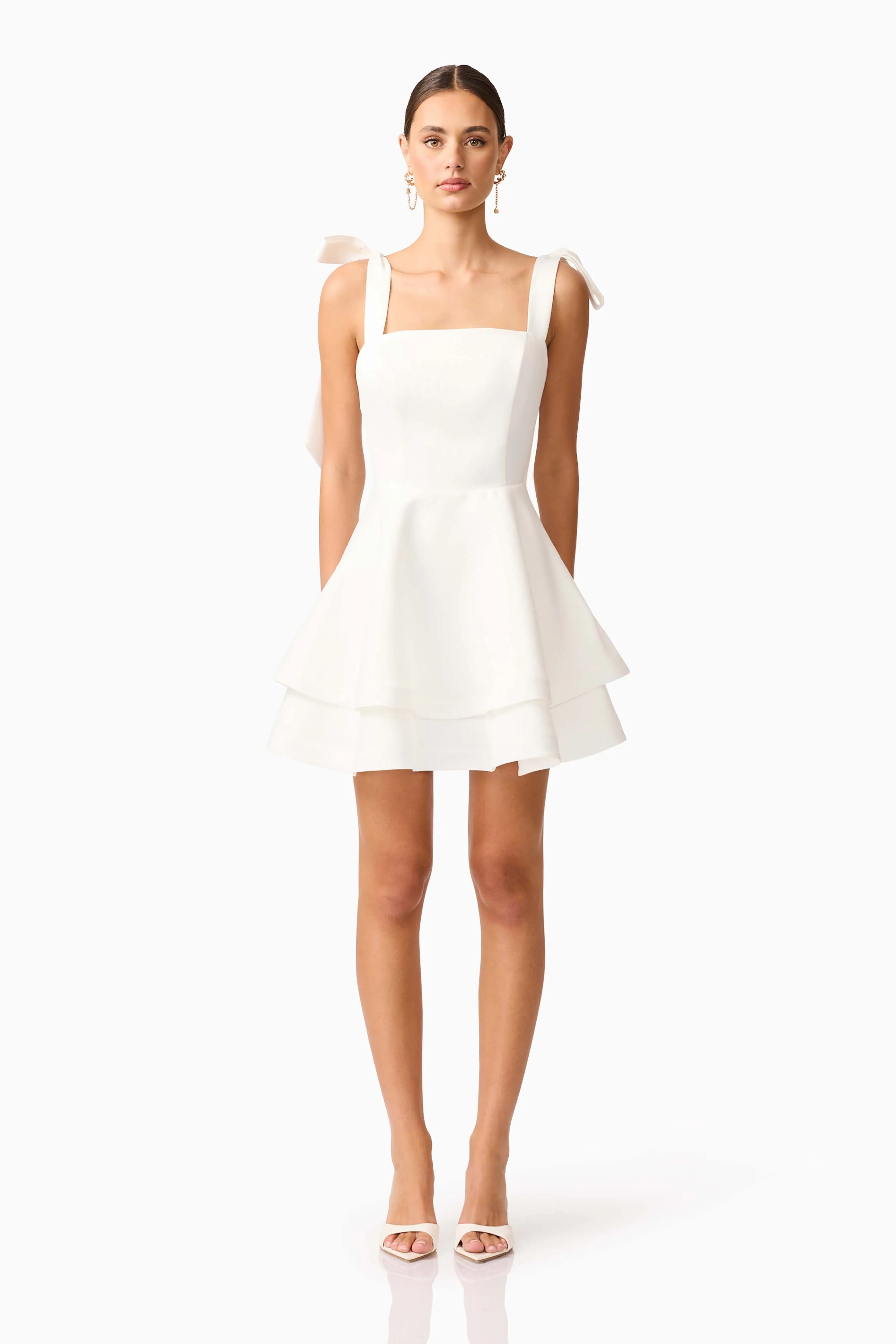 Livia Tiered Mini Dress in White sold by Elliatt