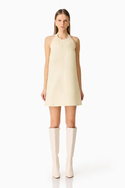 CURAAE Lavelle Halter Mini Dress in Lemon Yellow sold by Elliatt