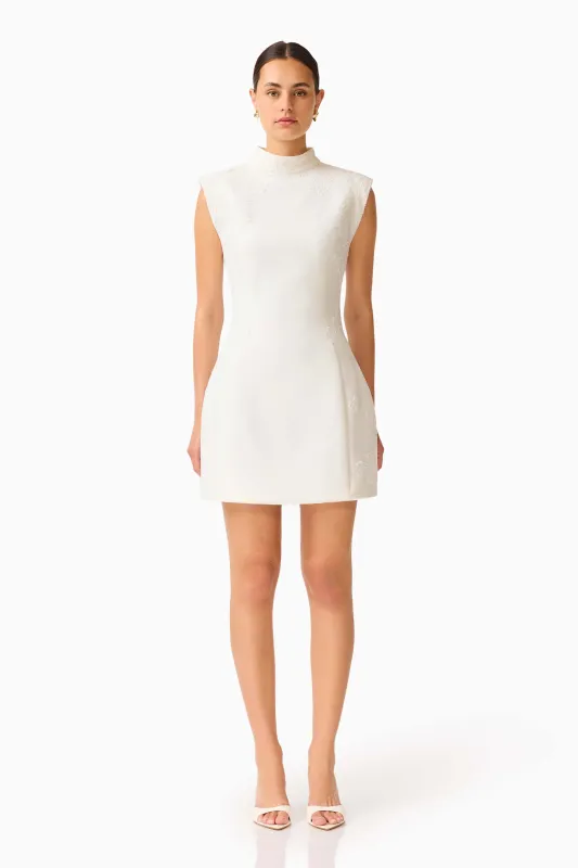 Elysia Lace Mini Dress in White made by Elliatt