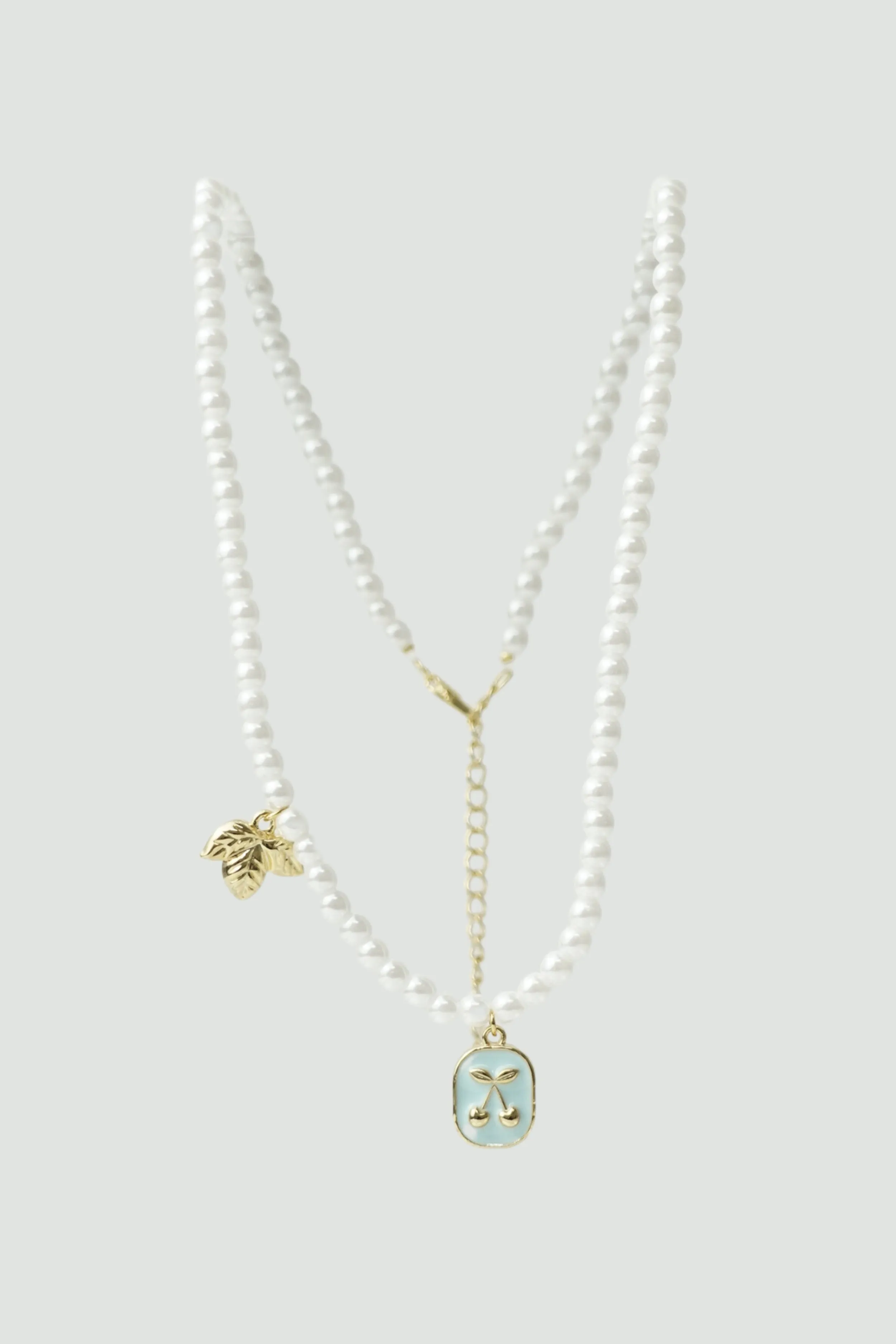 Cherry Gold Pearl Necklace sold by En Creme