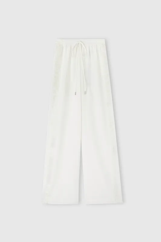 Ivory stretch silk trousers sold by Ermanno Scervino