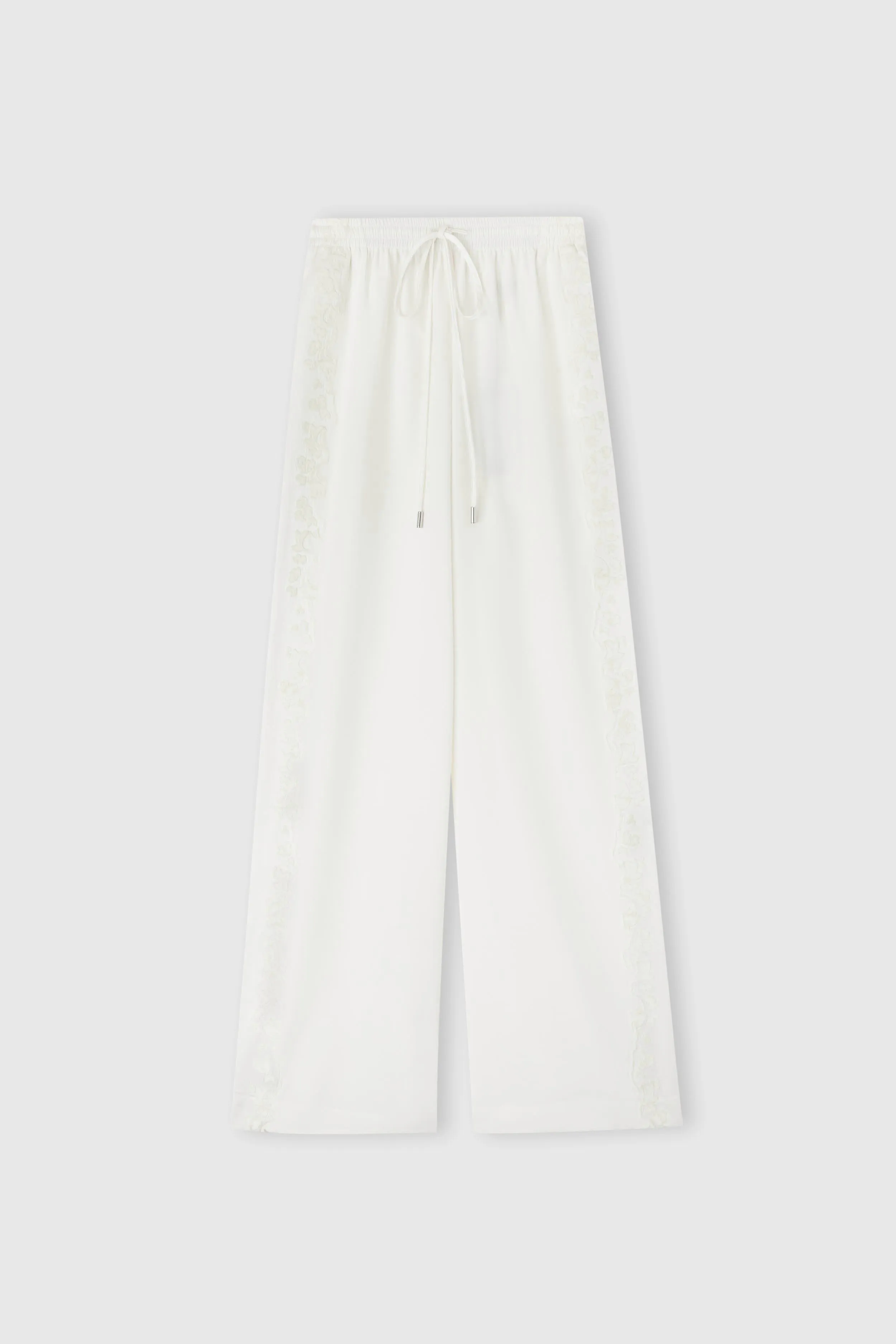 Ivory stretch silk trousers sold by Ermanno Scervino