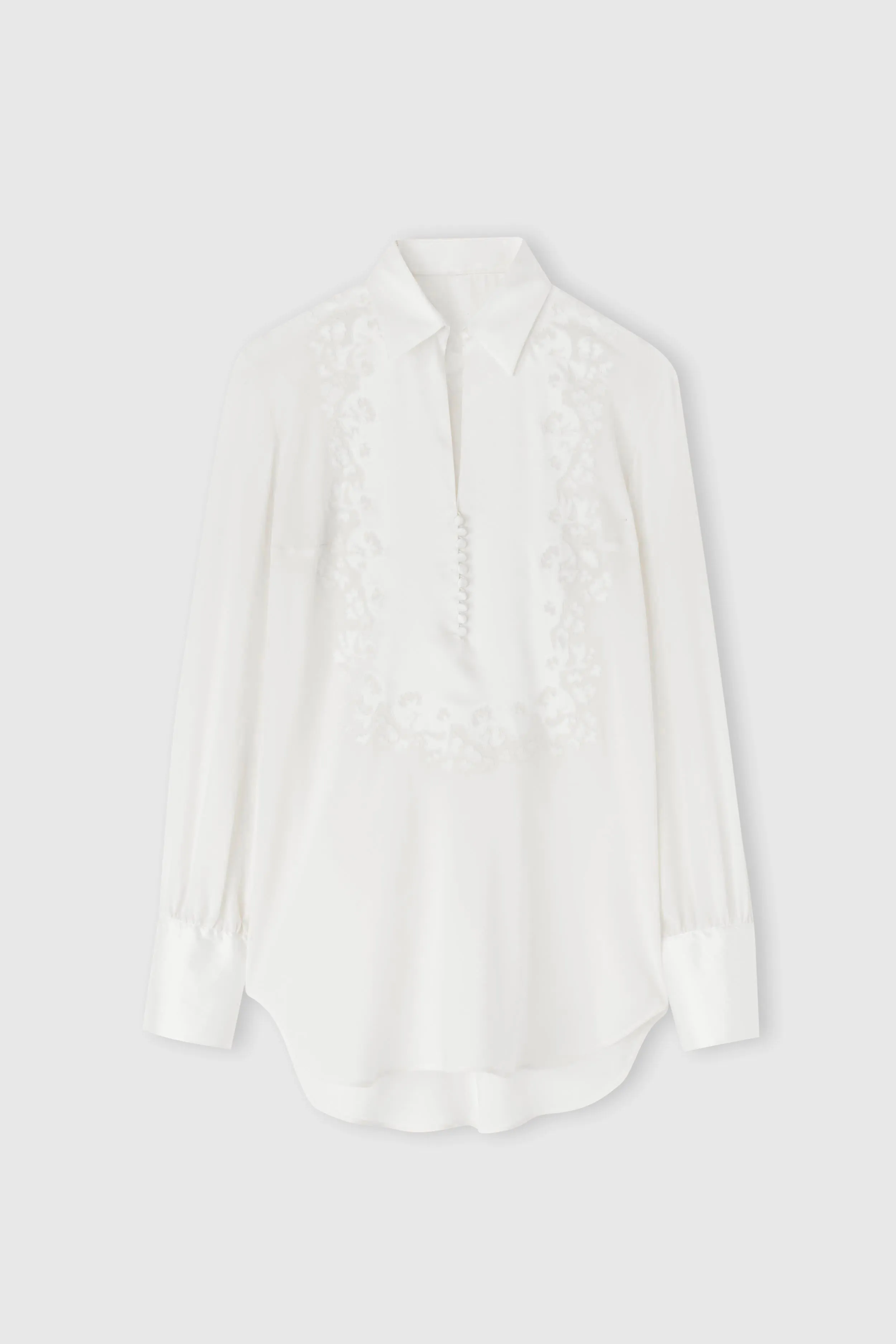 Silk blouse with hand-carved embroidery sold by Ermanno Scervino
