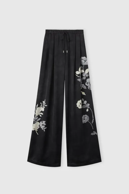 Pure silk trousers with floral print sold by Ermanno Scervino