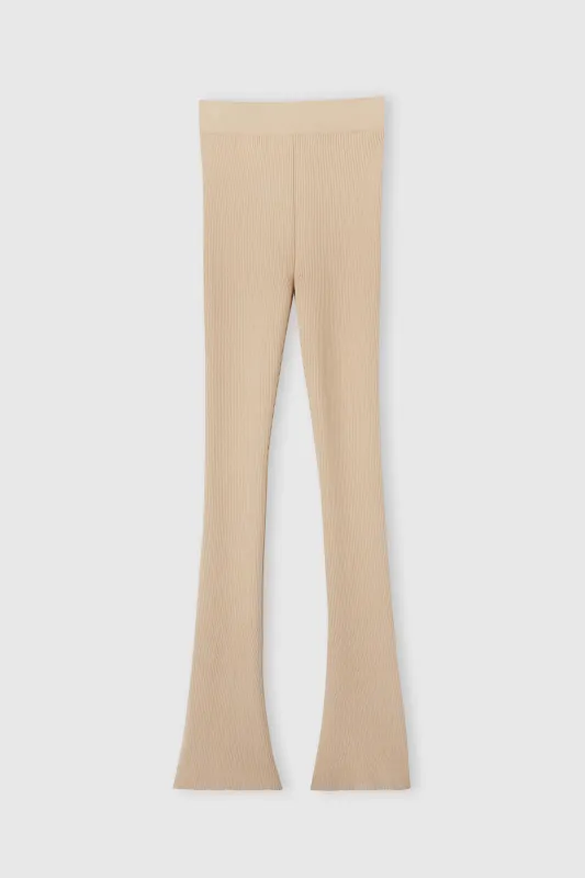 Nude viscose blend leggings with vertical rib pattern sold by Ermanno Scervino