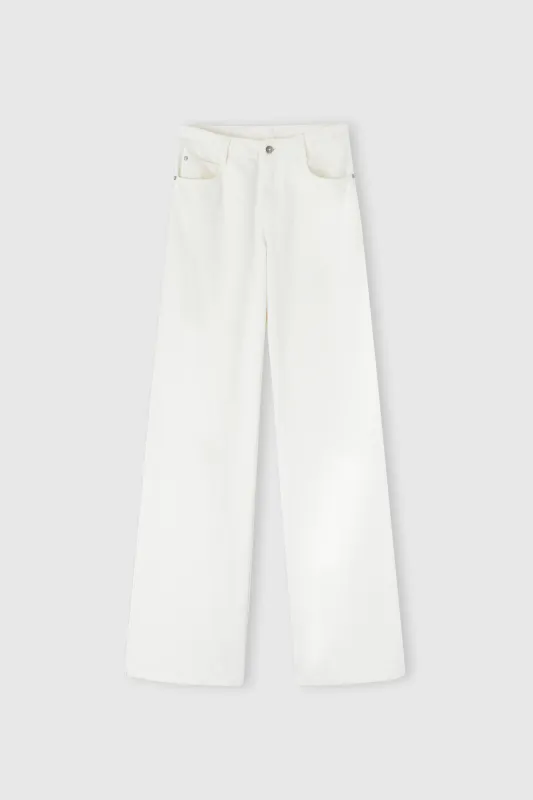 Palazzo trousers in white denim with floral cut-out sold by Ermanno Scervino