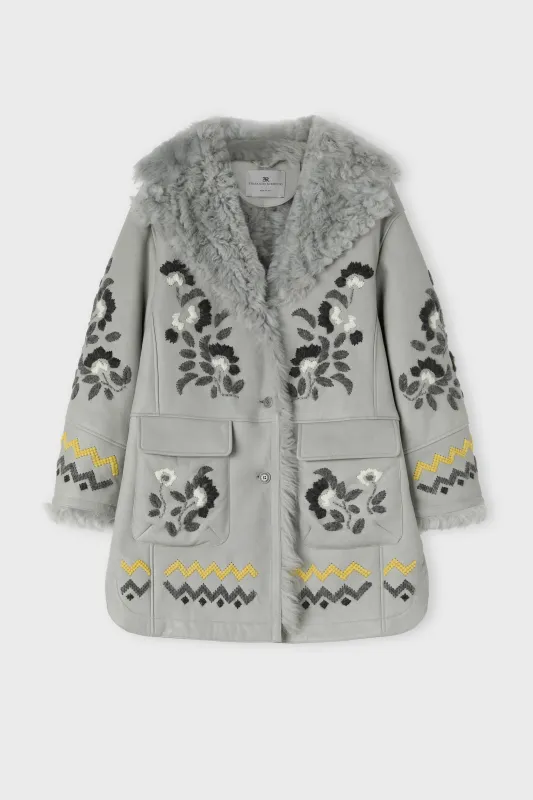 Shearling coat in genuine sheepskin with hand embroidery sold by Ermanno Scervino