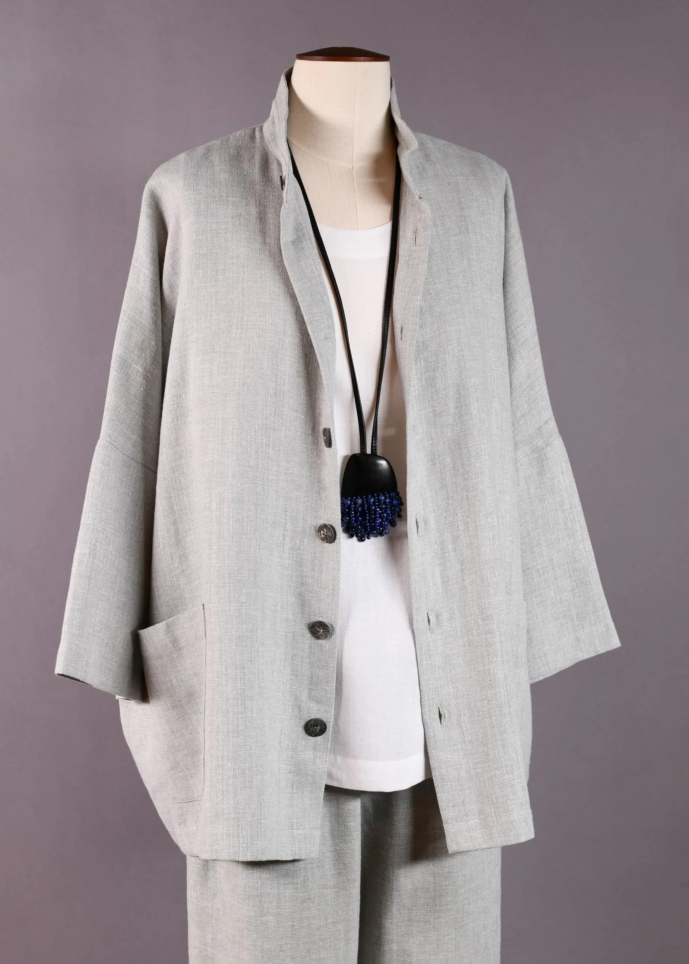 linen 3/4 sleeve sloped shoulder jacket with double stand collar- long sold by eskandar