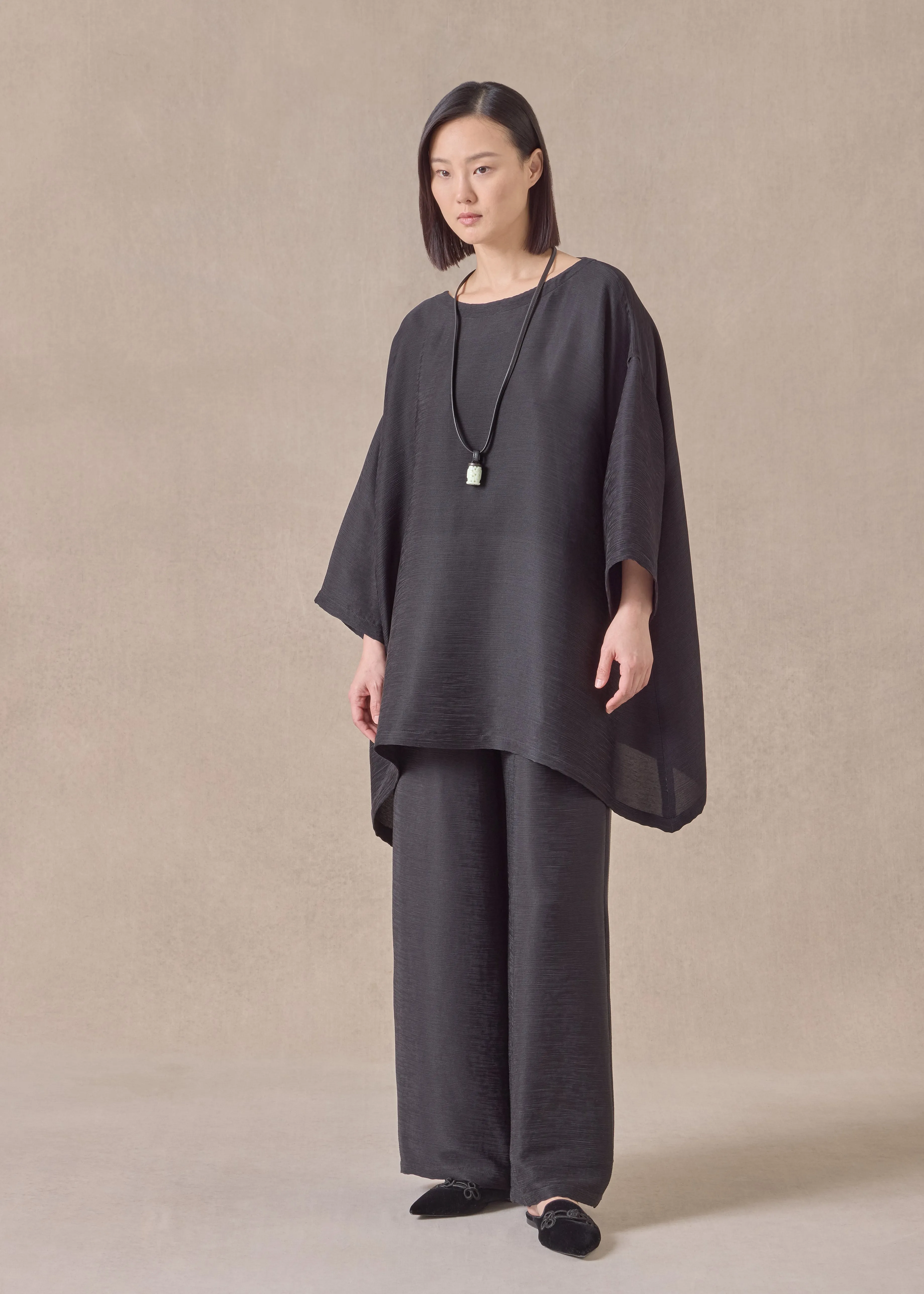 featherlight silk plisse wide a-line scoop neck top - long (black) sold by eskandar