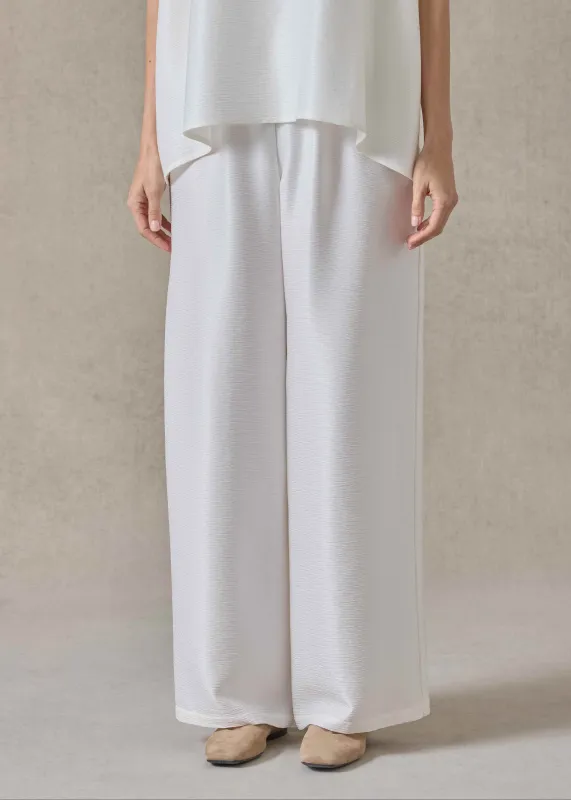 midweight silk plissé flared trouser (white) made by eskandar