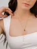 Pebble and Freshwater Pearl Lariat sold by ettika