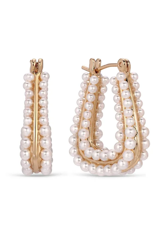 Soft Curve Pearl Lined Hoop Earrings sold by ettika