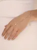Dripping Crystal Hand Chain sold by ettika
